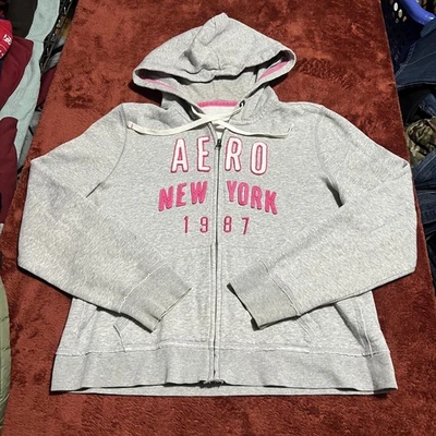 Sudadera con Capucha Aeropostale Para Mujer Gris Cremallera Completa AERO Nueva York 1987 Logo Sudadera Foto 1 de 4