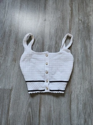 Camiseta sin mangas Aritzia Babaton esculpida tejida con botones blanca negra gruesa elástica recortada talla 2XS Foto 1 de 4