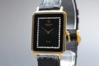 [Exc+5] Reloj de cuarzo para dama Raymond Weil Geneve Othello 130 oro negro 18 quilates  Foto 1 de 4