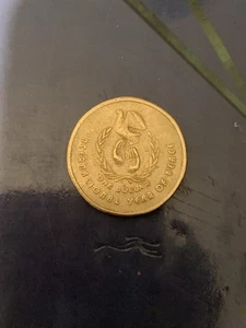 1986 AUSTRALIAN $1 ONE DOLLAR COIN INTERNATIONAL YEAR OF PEACE - Picture 1 of 2