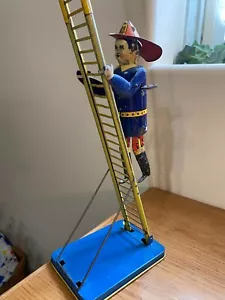 Juguete de hojalata de cuerda vintage de bombero de escalada Marx JA-08 - Imagen 1 de 7