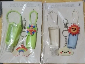 Händedesinfektionsmittel Lippenbalsam Schlüsselanhänger Flasche Bündel Set 2 Stück Rucksack Anhänger Sonne - Bild 1 von 3