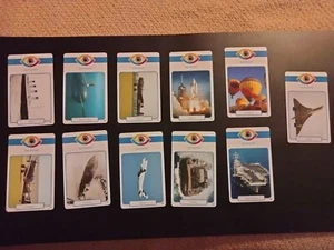 LOTE (11) aviones y barcos Eye Know⚓ IMAGEN DE TRIVIA tarjetas icónicas extrañas Envío gratuito - Imagen 1 de 4