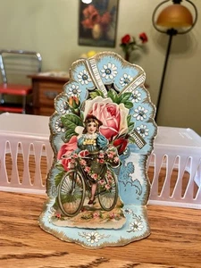 1920's 3D Pop Up-3 Layers! Valentine Embossed Girl on Bike Flowers Windmill - Picture 1 of 6