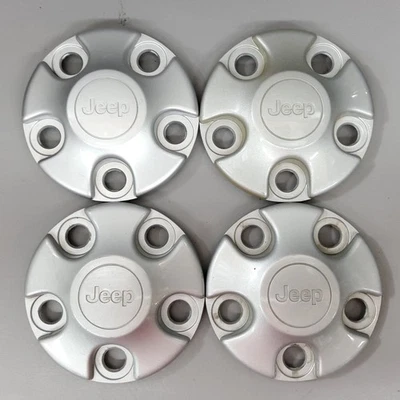 07-17 Juego de 4 tapacubos centrales de rueda de fábrica Jeep Wrangler 1AH90TRMAC Foto 1 de 4
