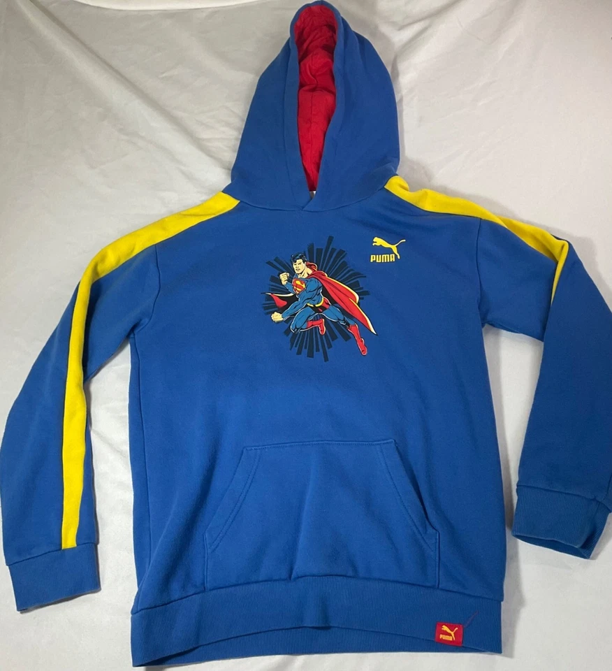 Puma DC Superman Niños Sudadera con Capucha Azul con Acentos Amarillos XL Canguro Bolsillo Algodón/Po Foto 1 de 3