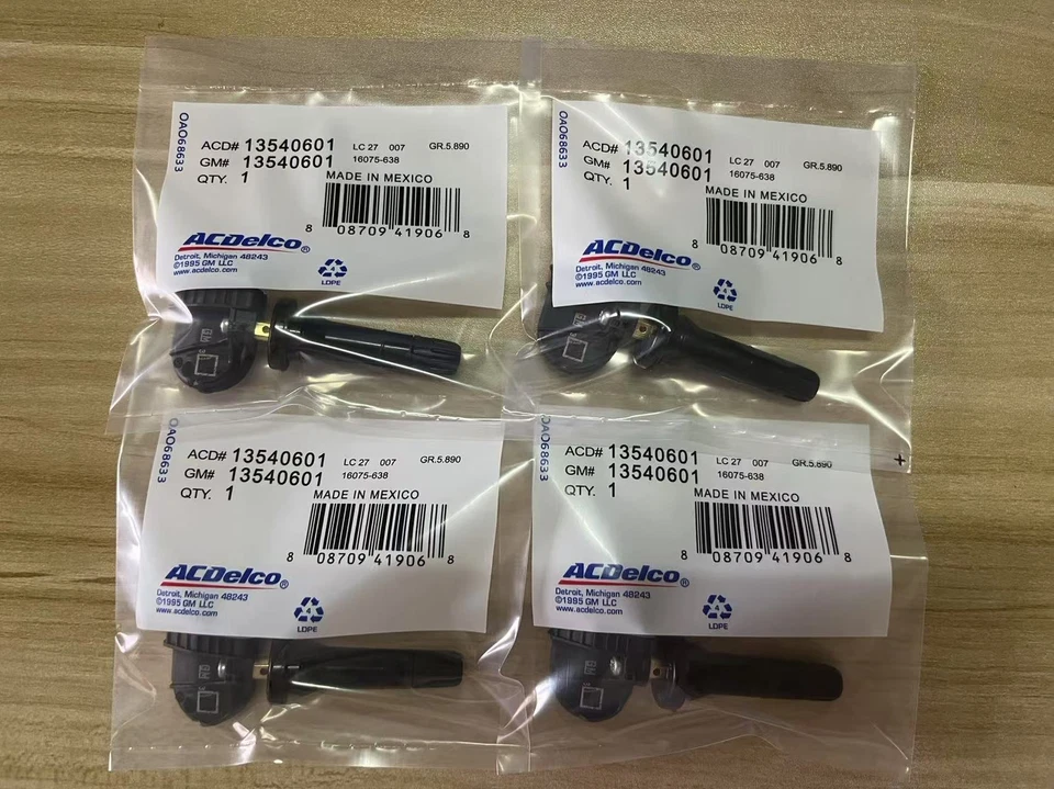 Sensor de presión de neumáticos genuino OEM TPMS 13540601 4 PIEZAS para camionetas y furgonetas GMC Foto 1 de 4