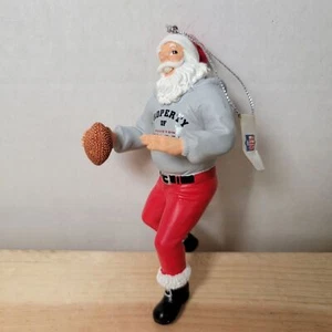 NFL Houston Texans Santa Playing Football Ornament 5" - Picture 1 of 6