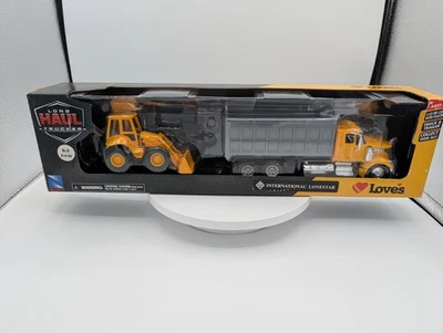 1/43 New-Ray International Lonestar Dump Truck and Front Loader with Trailer - Image 1 of 4