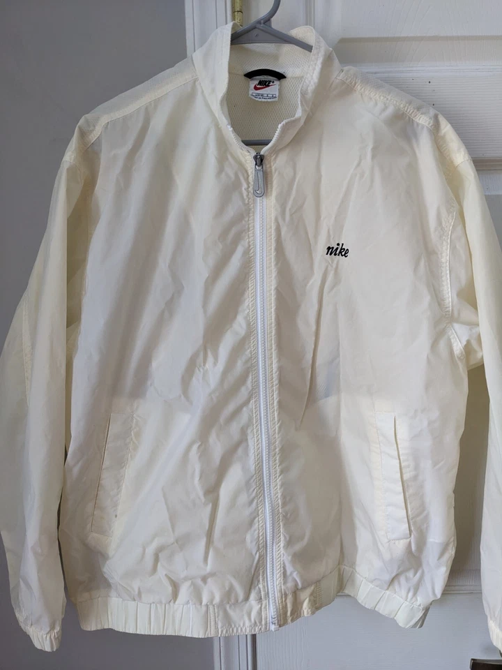 Chaqueta cortavientos Nike vintage años 90 marfil crema para mujer grande cremallera bolsillo oculto Foto 1 de 4