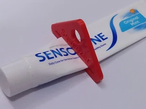 2 X RED TOOTHPASTE TUBE SQUEEZER REUSABLE TOOTHPASTE DISPENSER 2 PACK - Picture 1 of 3