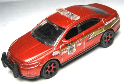 2010 MATCHBOX FORD POLICE INTERCEPTOR FIRE CHIEF ORANGE 1:64 DIECAST 3" CAR - Image 1 of 4