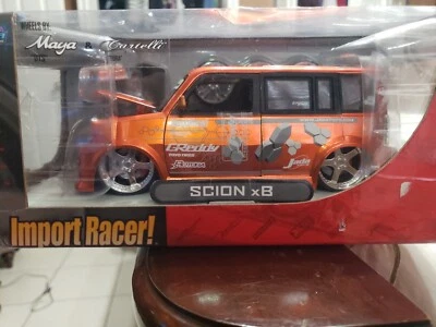 Jada Import Racer Scion xB naranja escala 1 24 modelo diecast con ruedas adicionales caja defectuosa Foto 1 de 4