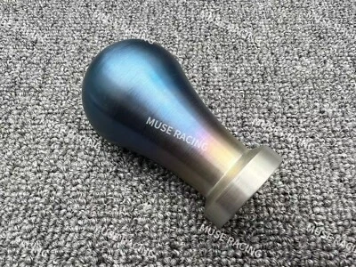 Cuchara deportiva estilo titanio forma gota de agua aluminio con peso perilla de cambio de marchas Foto 1 de 4