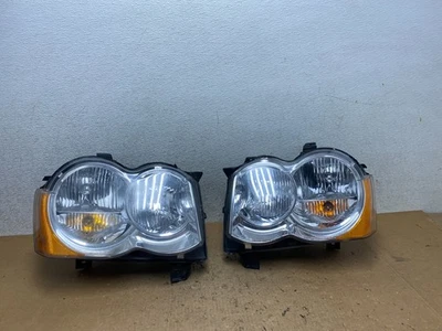 Juego de faros halógenos izquierdo+derecho Jeep Grand Cherokee 2009-2010 Q8766 DW Foto 1 de 4