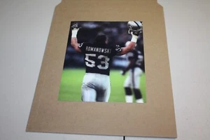 OAKLAND RAIDERS BILL ROMANOWSKI #53 UNSIGNED 8X10 PHOTO CELEBRATION POSE - Picture 1 of 1
