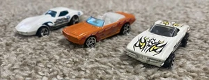 HotWheels lot of 3 '69 Orange Chevy Camaro, '75 Stingrary Corvette, '65 Corvette - Picture 1 of 16