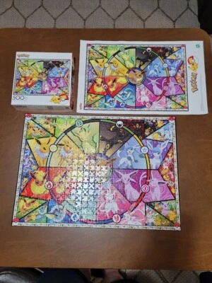Rompecabezas Buffalo Games 500 piezas Pokemon Eevee's vitral incluye póster Foto 1 de 4