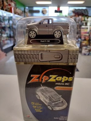 ZIP ZAGS RADIO SHACK MICRO RC FORD F-150 NUEVO EN CAJA CAMIÓN CONTROL REMOTO ESCALA 1/64  Foto 1 de 4