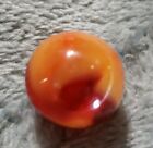 Akro Agate Corkscrew Marble. Bright orange in Transparent Amber