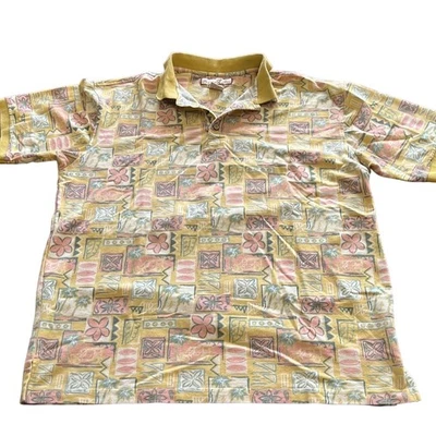 Camisa polo de golf tejida con estampado tropical multicolor azul Paradise para hombre talla grande Foto 1 de 4