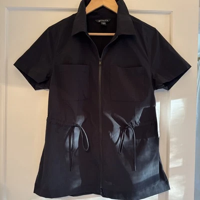 Top Athleta Cinch negro cremallera completa mangas cortas repelente al agua para mujer mediano nuevo con etiquetas Foto 1 de 4