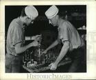 1942 Press Photo Pearl Harbor, Seabees inspect aircraft engine parts carefully