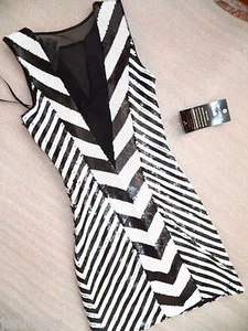 NUEVO CON ETIQUETAS Bebe Vestido negro blanco lentejuelas malla top falda fiesta club XS 0 2 profundo v sexy - Imagen 1 de 6