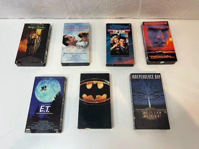 Lot 7 VHS Movies Batman Top Gun ET Days of Thunder Robin Hood Independence Day + - Image 1 of 4