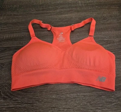Sujetador deportivo New Balance naranja neón para mujer gimnasio entrenamiento correr talla pequeña Foto 1 de 4