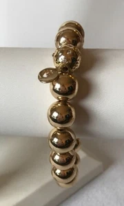 Goldfarbenes dehnbares Perlenarmband mit Strassakzent Gloria Vanderbilt - Bild 1 von 1