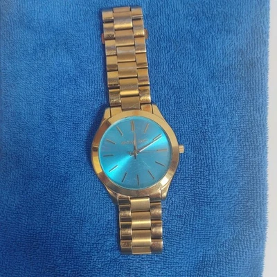 Reloj Michael Kors Slim Runway MK-3265 tono dorado esfera azul acero inoxidable 42 mm Foto 1 de 4