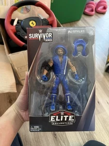 FIGURA WWE ELITE COLLECTION SURVIVOR SERIES ESTILOS AJ con EQUIPO DE ENTRADA NUEVO - Imagen 1 de 5