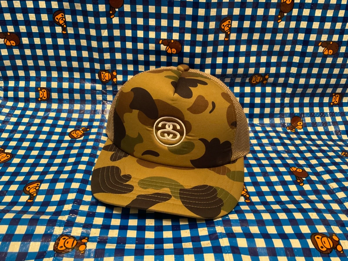 A Batthing Ape x Stussy 30th Anniversary Camo Trucker Cap Bape