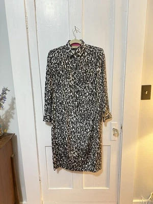 Vestido midi vintage años 70 Schrader deportivo blanco y negro manga larga Foto 1 de 4