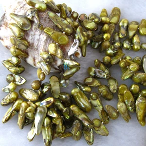 Collana di perle d'acqua dolce madre barocca oliva 49" 6-7mm - Foto 1 di 4