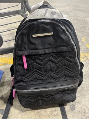 Mochila negra para mujer Betsey Johnson bolsa para libros forro floral correa rasgada usada en excelente estado Foto 1 de 4