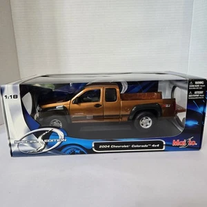 2004 CHEVY COLORADO Z71 4X4 NIB!! RARE FIND MAISTO 1:18 SPECIAL EDITION ORANGE - Picture 1 of 11