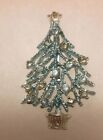 Light Blue Silvertone Tree With Clear Rhinestones. Measures 2.5 inches 