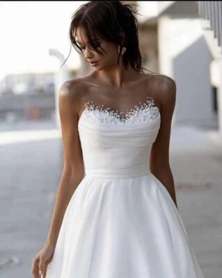 Elegante Vestido de Novia Illusion Cuello Satinado Organza Línea A Sin Mangas Foto 1 de 4