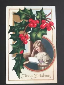 Frohe Weihnachten Mädchen liest Stechpalme gold geprägt Whitney Made antike Postkarte - Bild 1 von 5