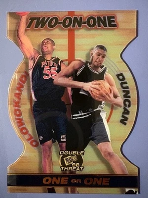 1998-99 Olowokandi/Duncan Press Pass Doble Amenaza Dos en Uno Acrílico Troquelado Foto 1 de 2