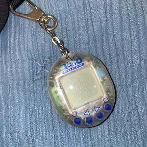 Tamagotchi Nano Puppy Digital Pet - RARE CLEAR - 1997 - TESTED Needs New Batteri - Bild 1 von 2