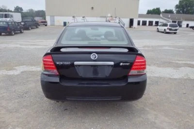 06 MONTEGO SUN VISOR/SHADE DRIVER SIDE TAN-H7,CLOTH,W/ VANITY 867405 - Image 1 of 4