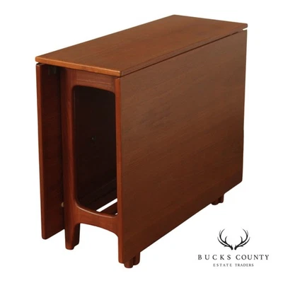 Mesa de comedor moderna danesa Kleppe Møbelfabrik de teca con hojas caídas Foto 1 de 4