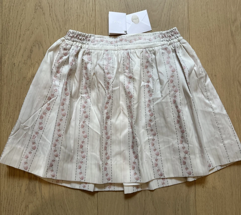 全新带标签 100% 正品 Christian Dior 儿童女孩迷你裙 - 10 码 - 象牙色和粉红色 — 第 1/4 张图片