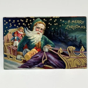 Tarjeta postal de Navidad de Papá Noel en relieve en trineo verde sobre oro c1910 - Imagen 1 de 3