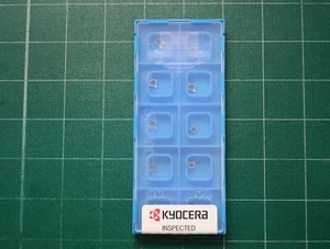 Insertos de carburo giratorio Kyocera CCGT030104L-F KW10 CCGT11091L-F 10 piezas (1 caja) - Imagen 1 de 3