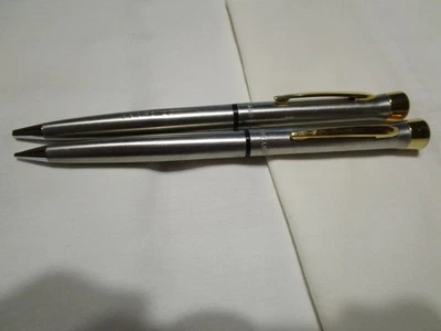 2 GUIRNALDA VINTAGE EE. UU. PLATA/ORO PUBLICIDAD BOLÍGRAFOS TAPA BURBUJA SIN TINTA Foto 1 de 4