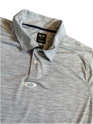 Camisa Polo Oakley Para Hombres Gris Manga Corta Cuello Calce Regular Talla XL Foto 1 de 4